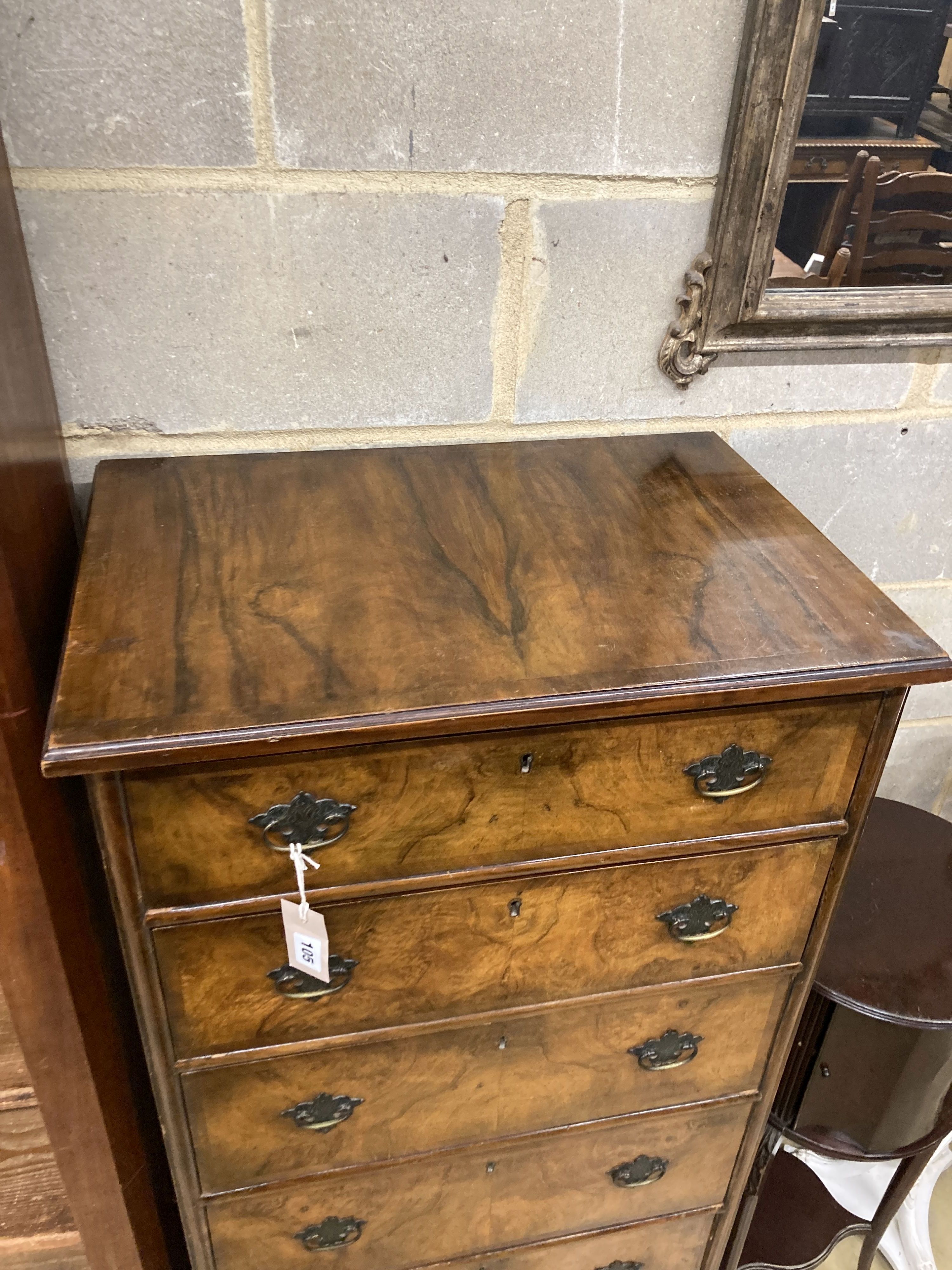 An early 20th century Queen Anne revival walnut narrow six drawer chest, width 61cm, depth 42cm, height 136cm